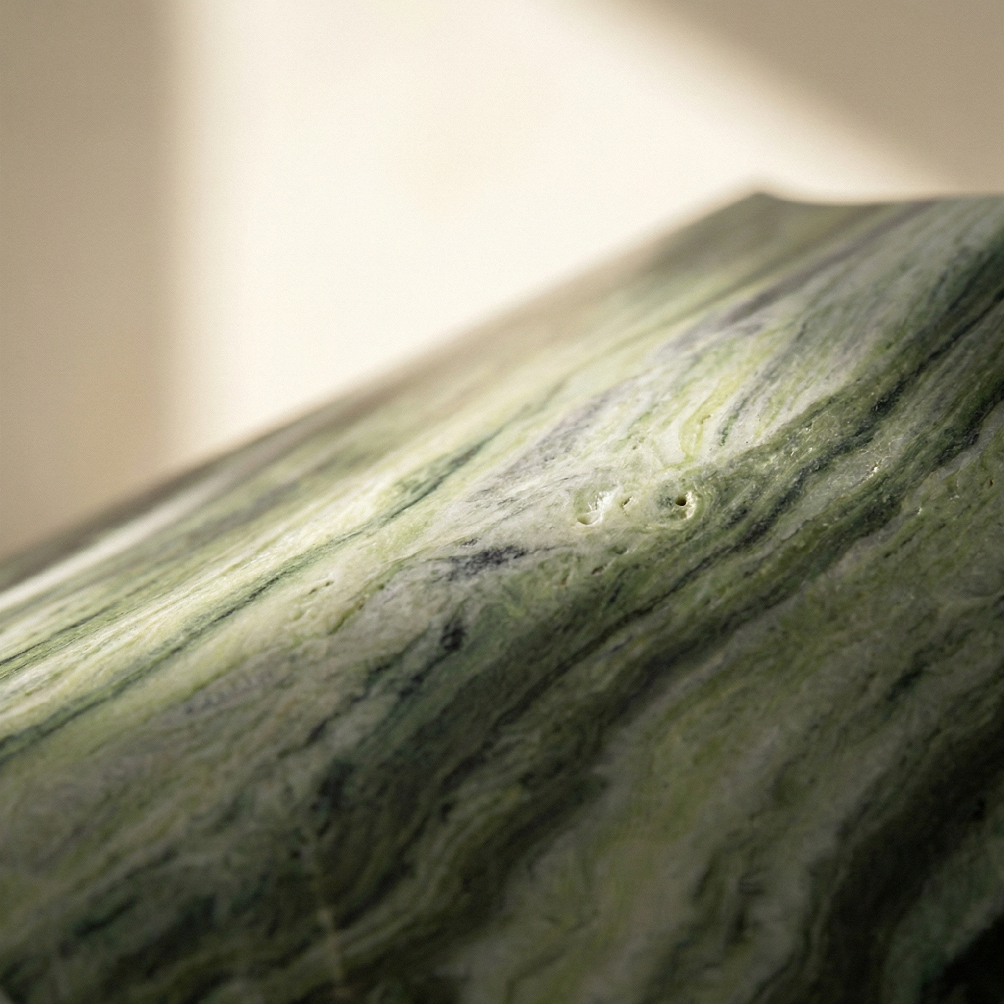 Marble surface on the Cono — polished stone catching diffused light