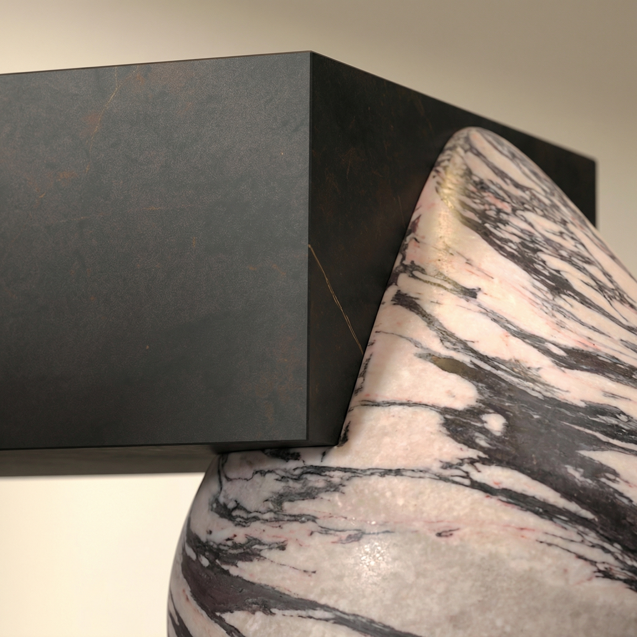 Surface transition detail — stone meeting stone at Flint's base