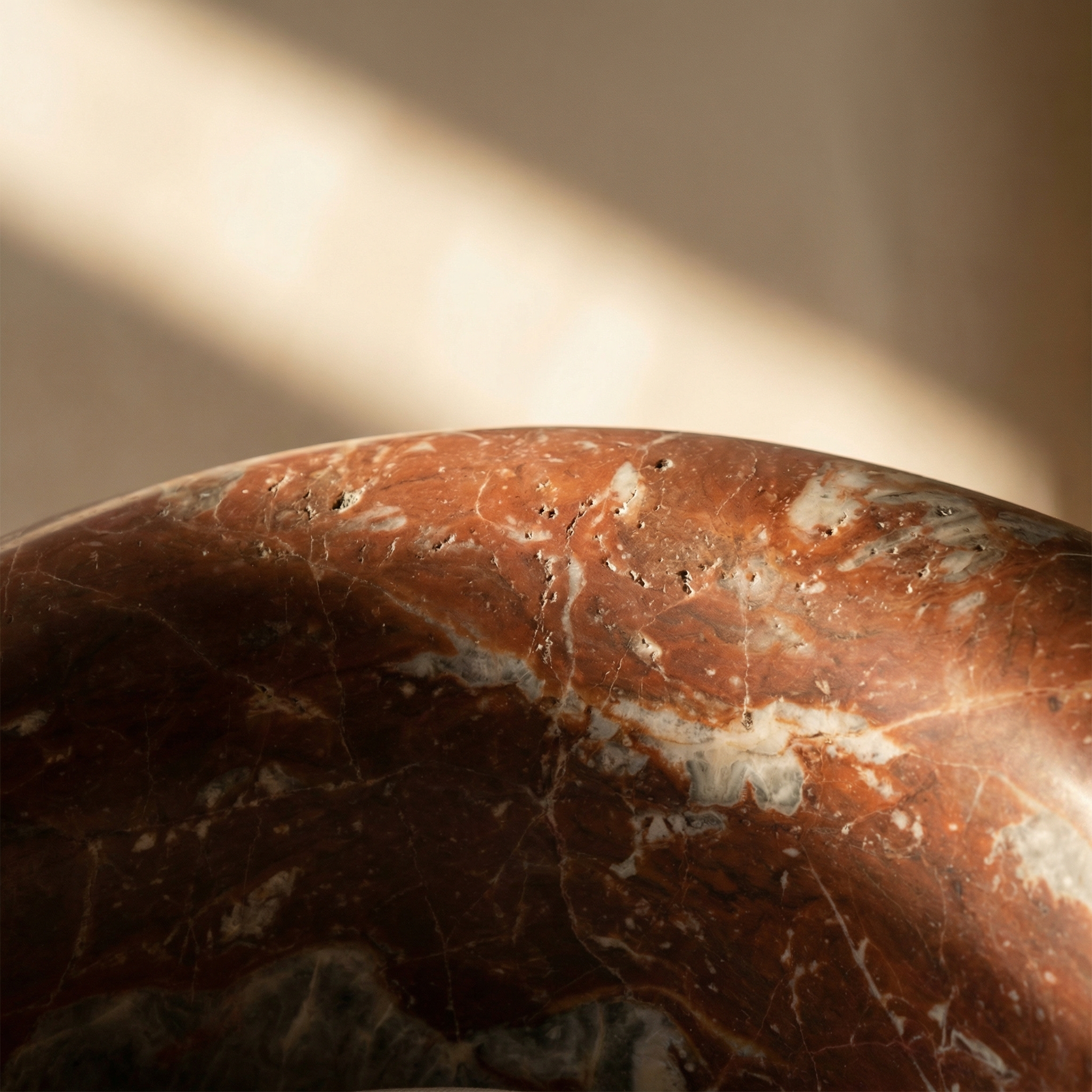 Gesto surface detail — stone texture and mineral depth under studio light