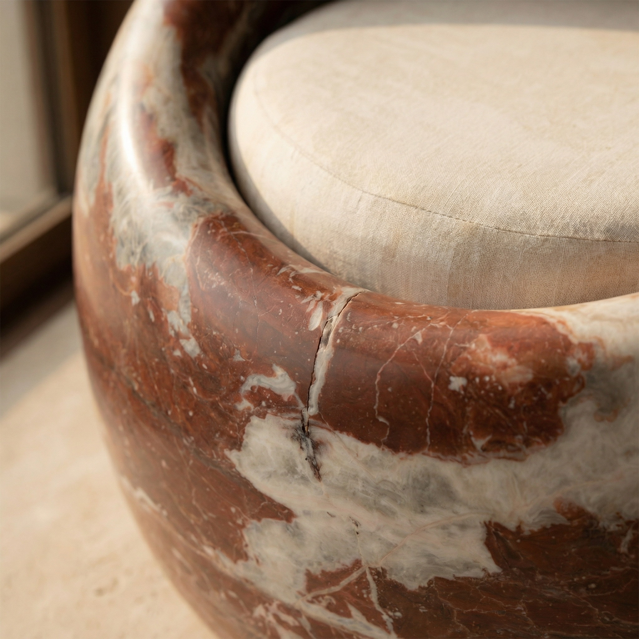 Surface transition detail — stone's base meeting the surface it rests on