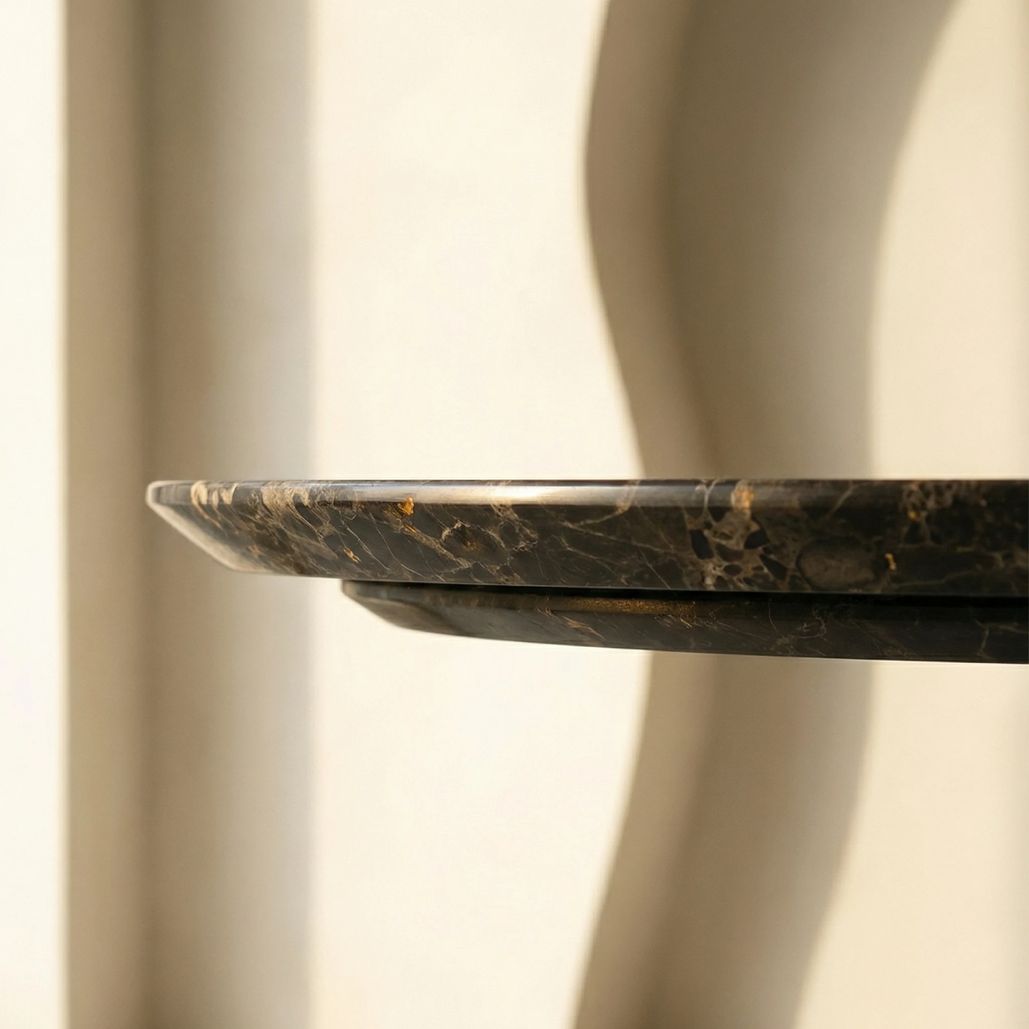 Bronze edge detail — the finished perimeter