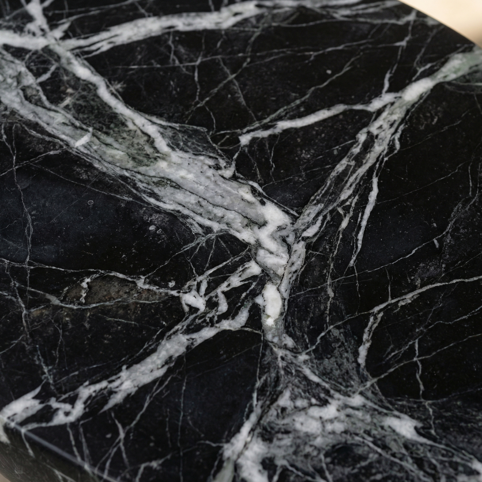 Calacatta Viola veining across the Morphe table surface