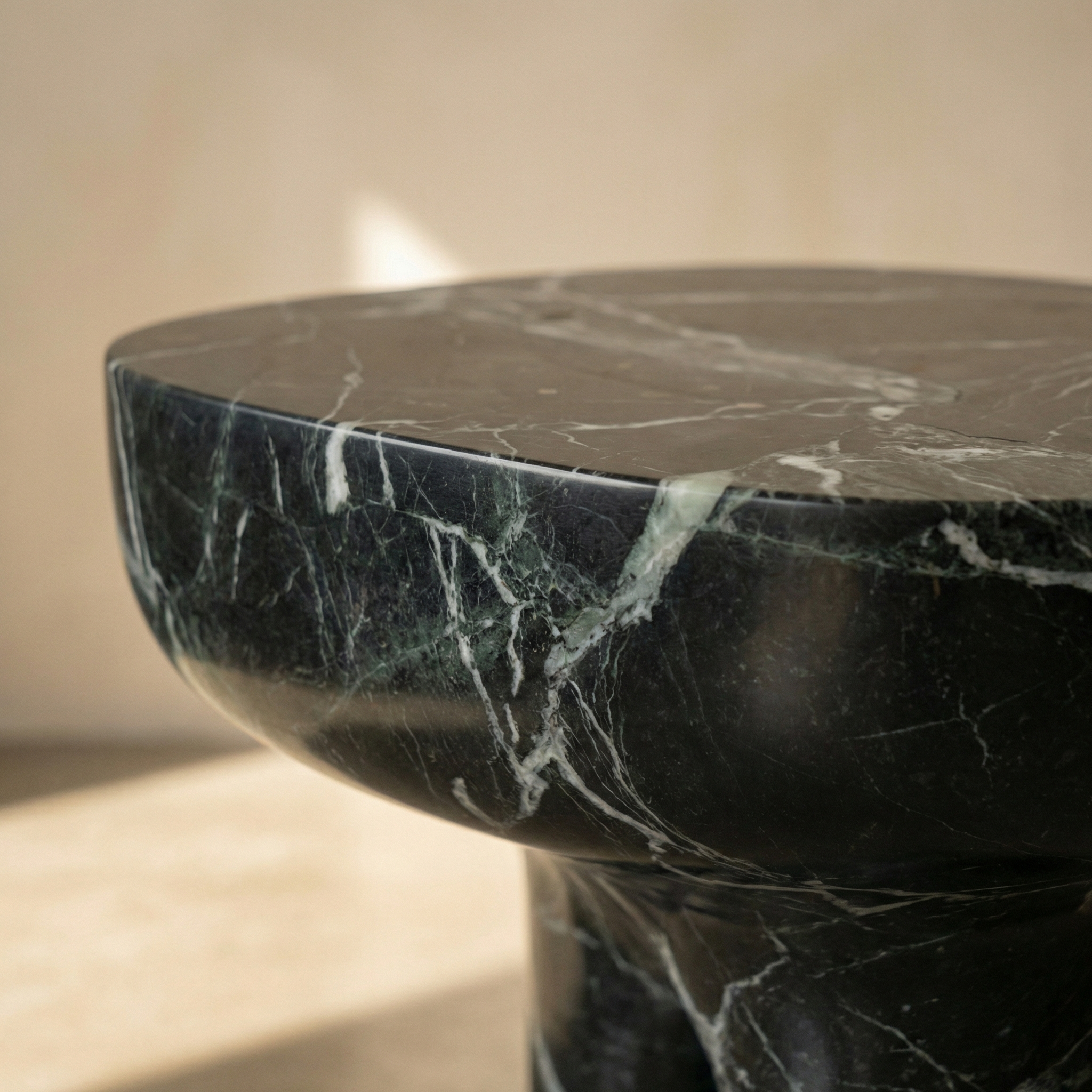 Hand-finished edge where tabletop meets the tapered column