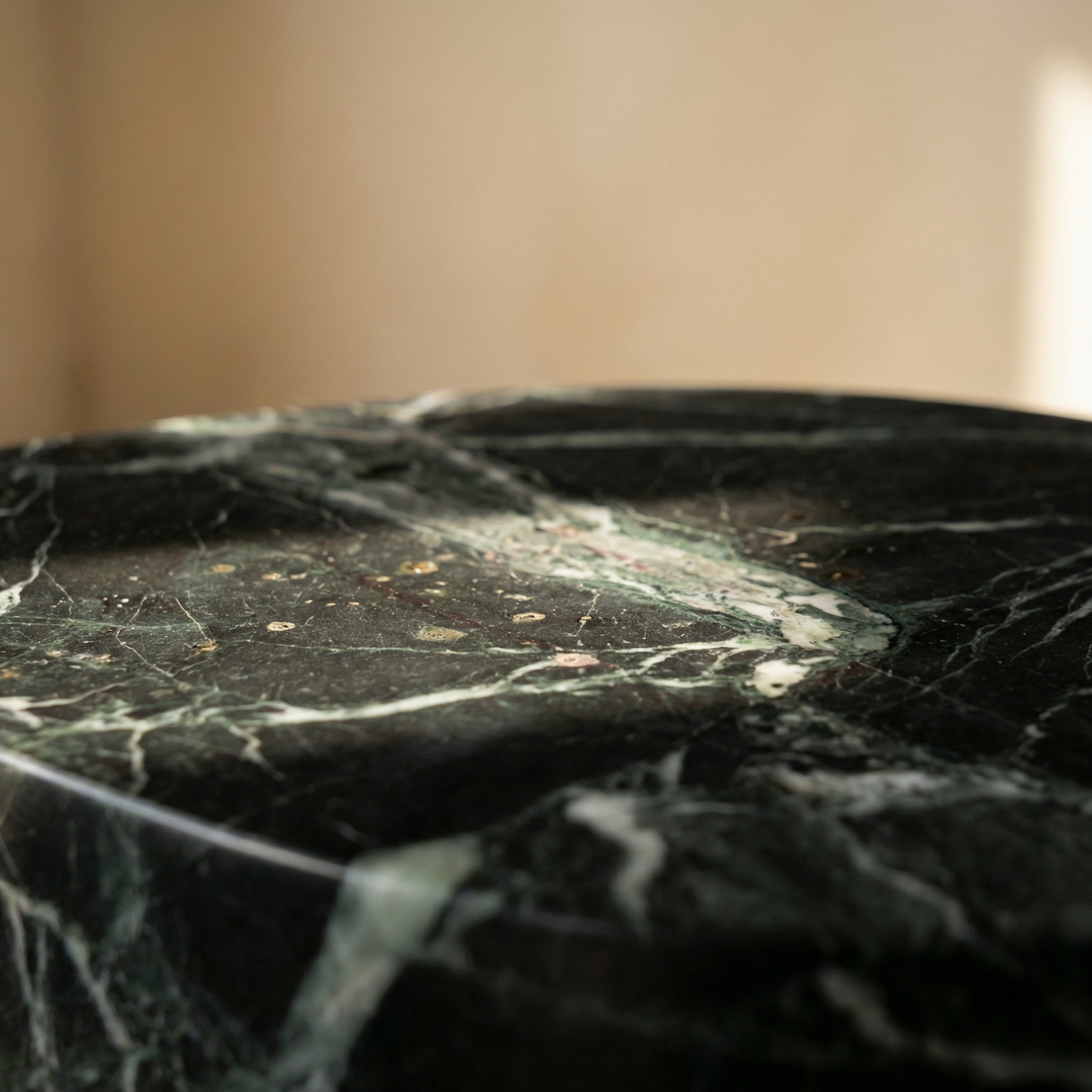 Honed marble surface of the Morphe side table — veining and texture detail