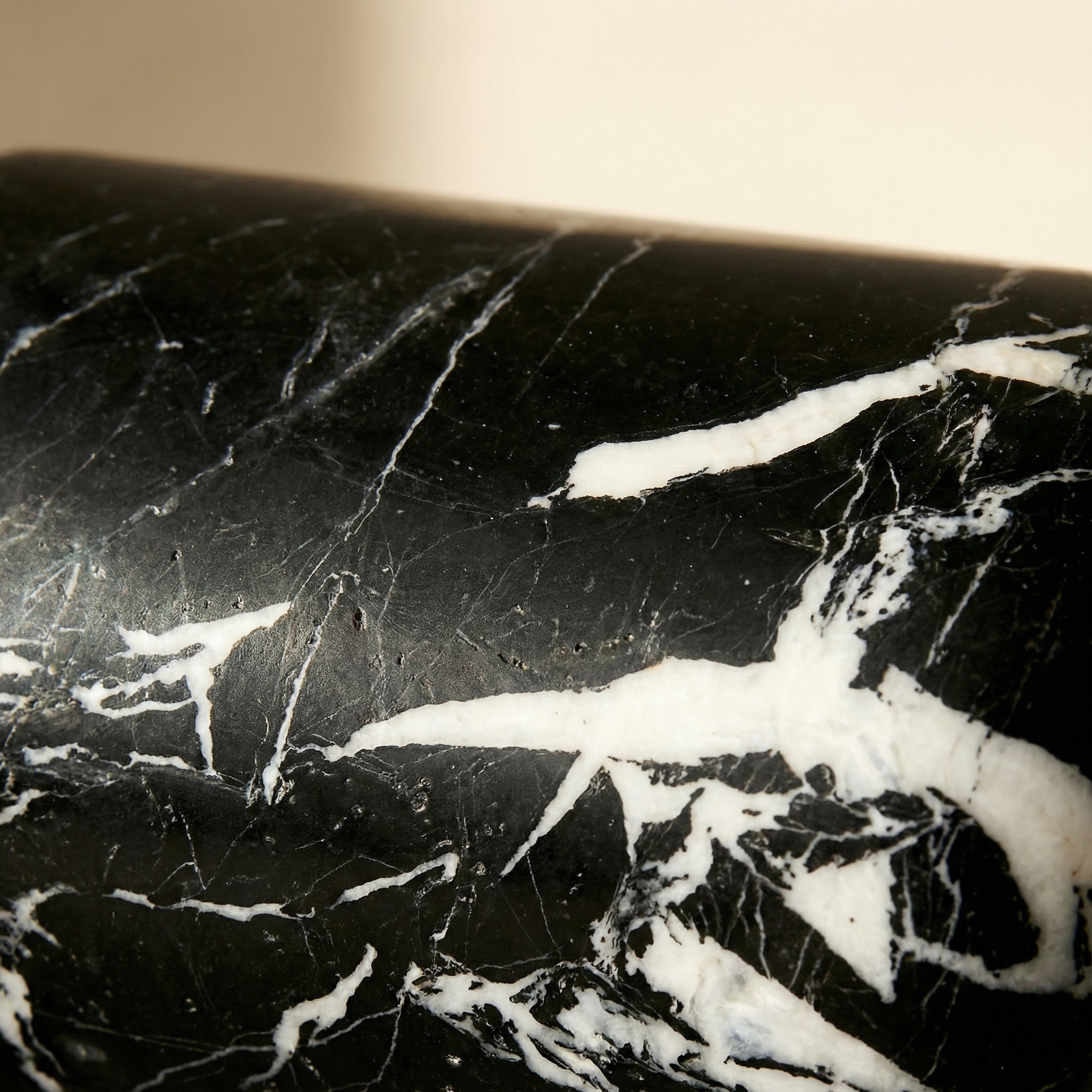 Marble surface on the Doge Small — polished stone catching diffused light