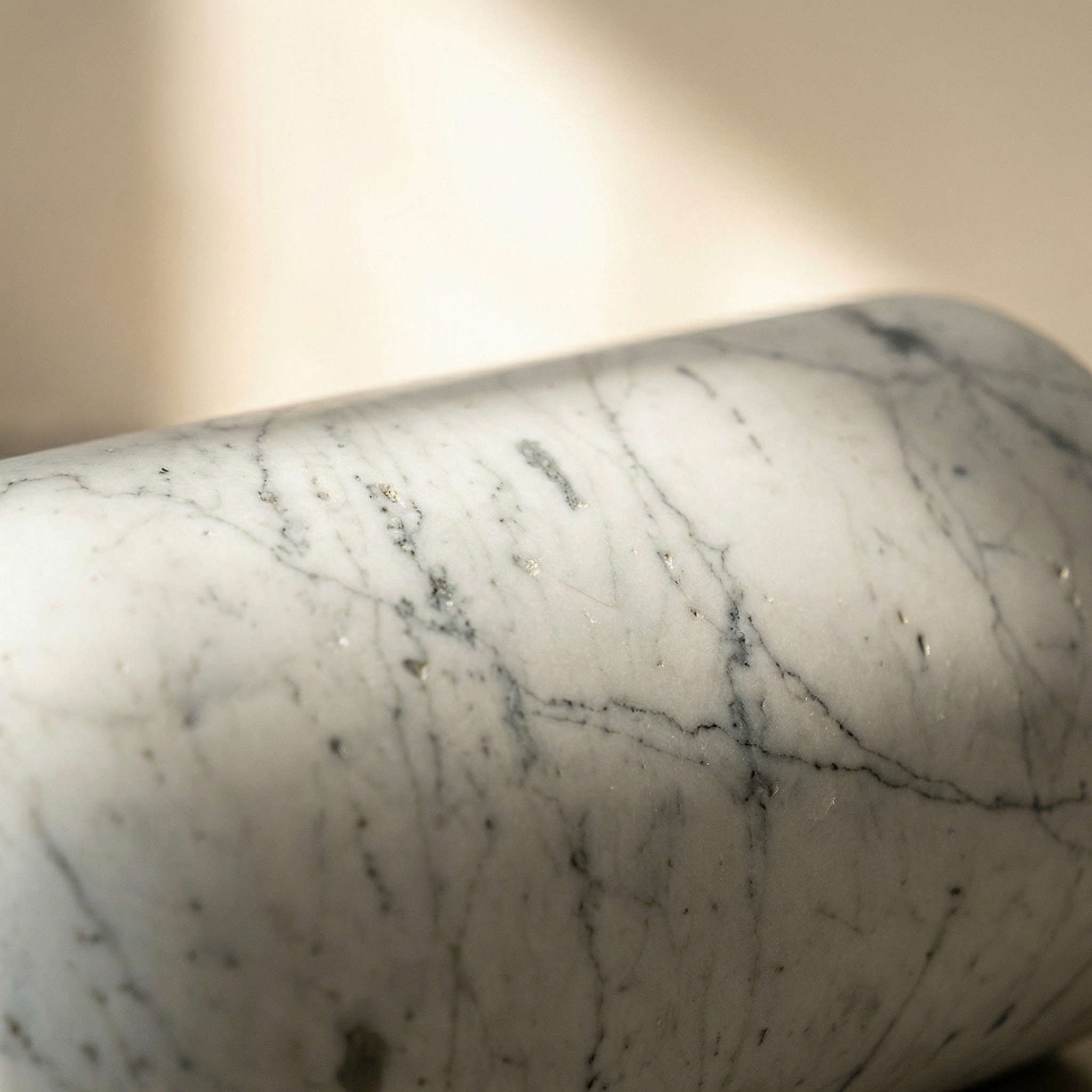 Marble surface detail — the polished exterior of the Doge Tall catching raking light