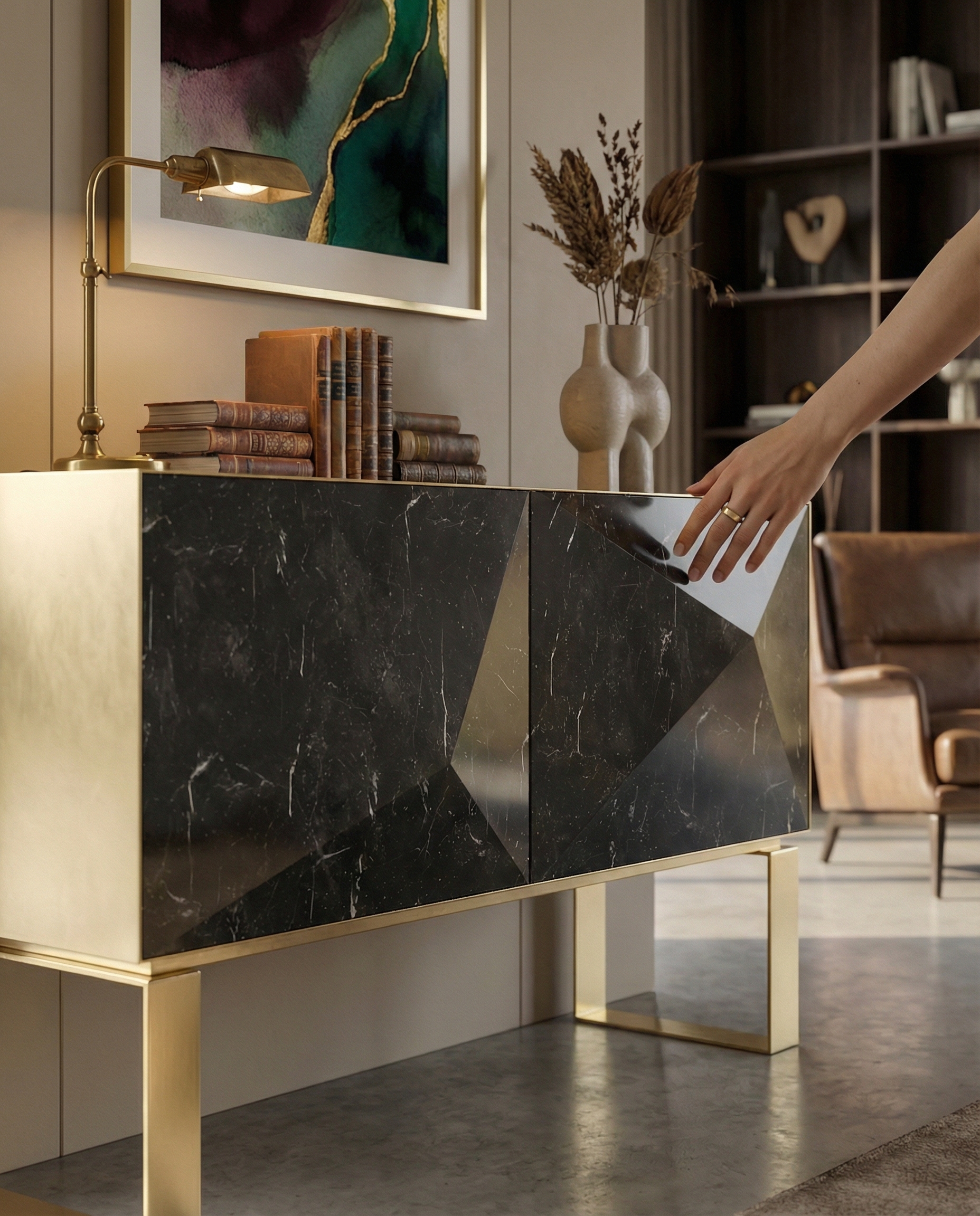 Hand opening the Punta cabinet door — tactile quality of the marble surface