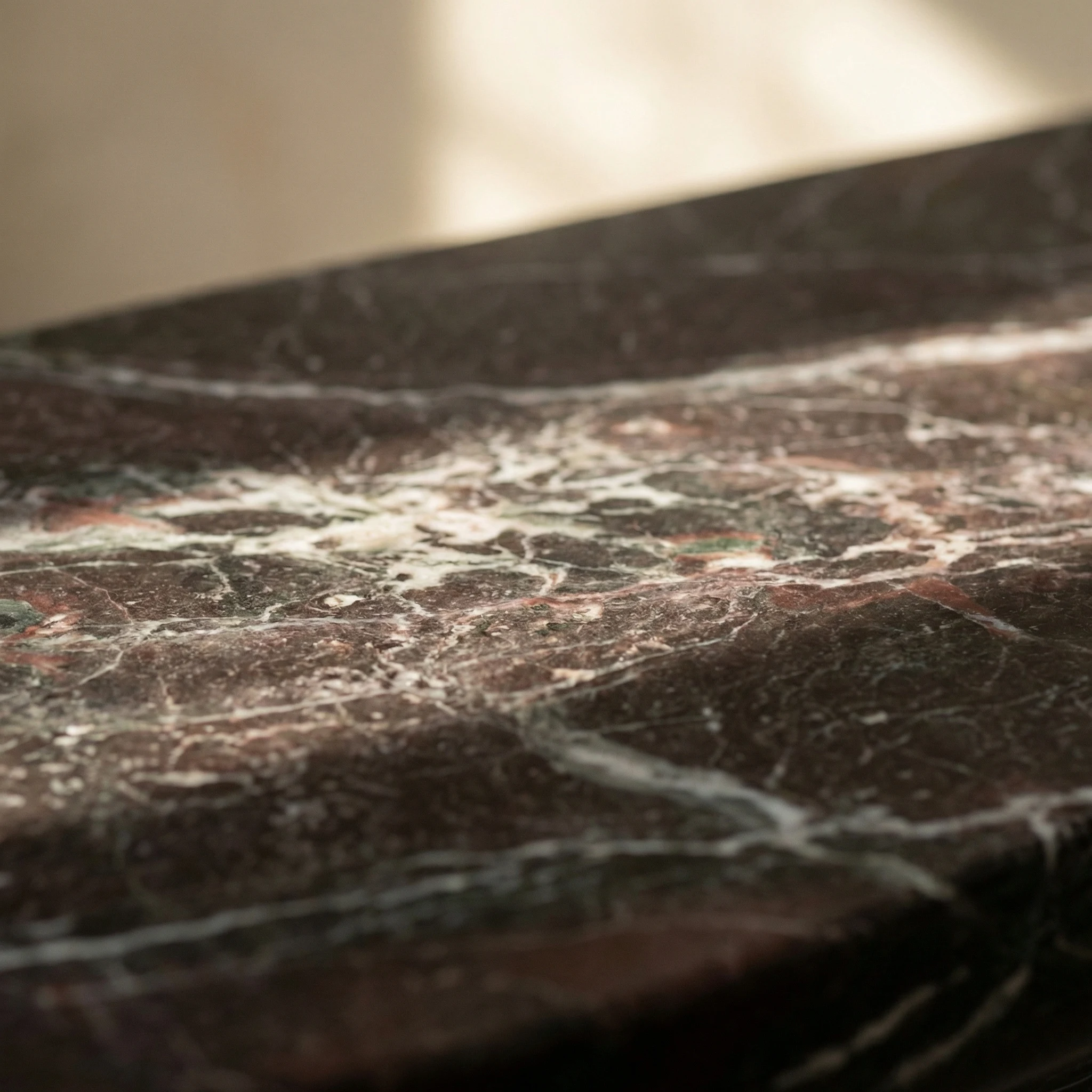 Polished stone surface with natural veining